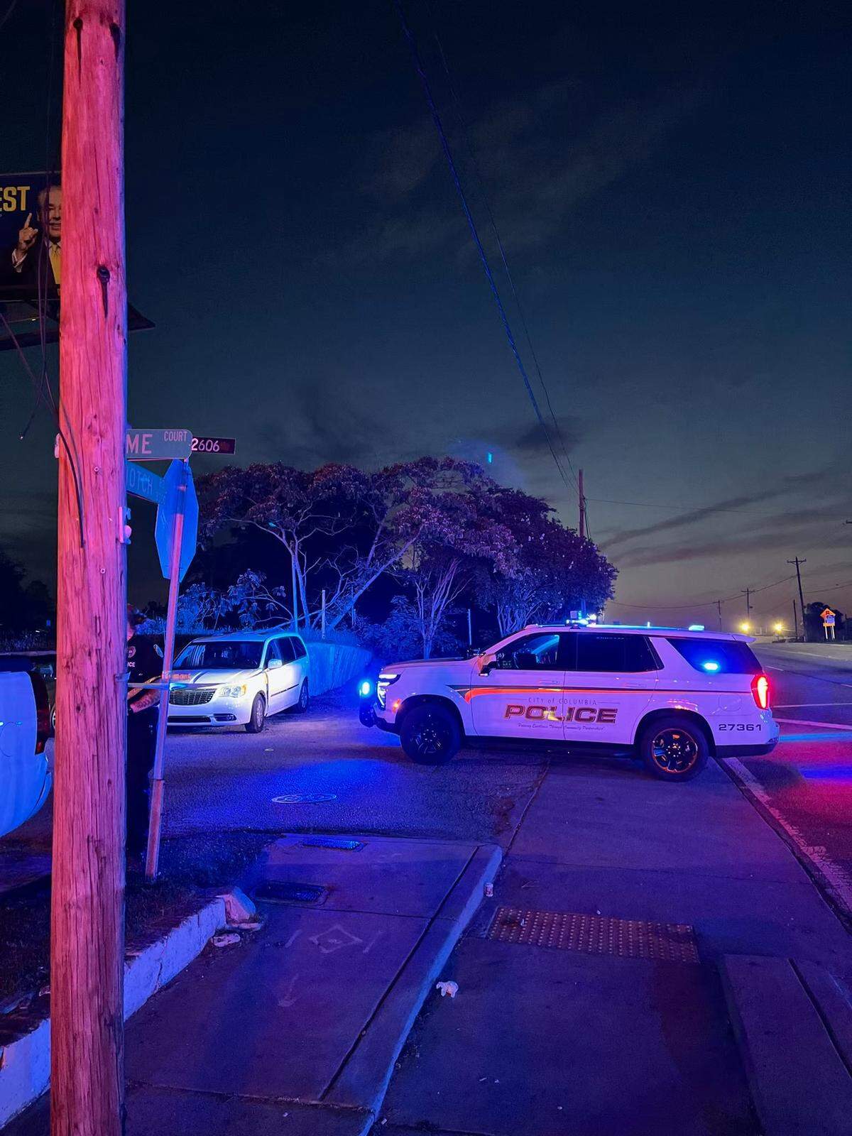 Members of the Columbia Police Department investigate a fatal shooting.