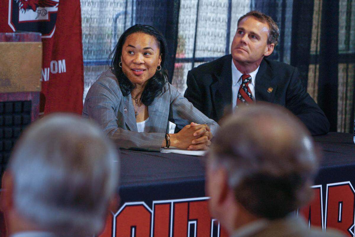 May 10, 2008: Dawn Staley and USC media relations director Steve Fink listen to USC director of athletics Eric Hyman talk about Staley’s career. USC introduced Staley as the new women’s basketball coach.