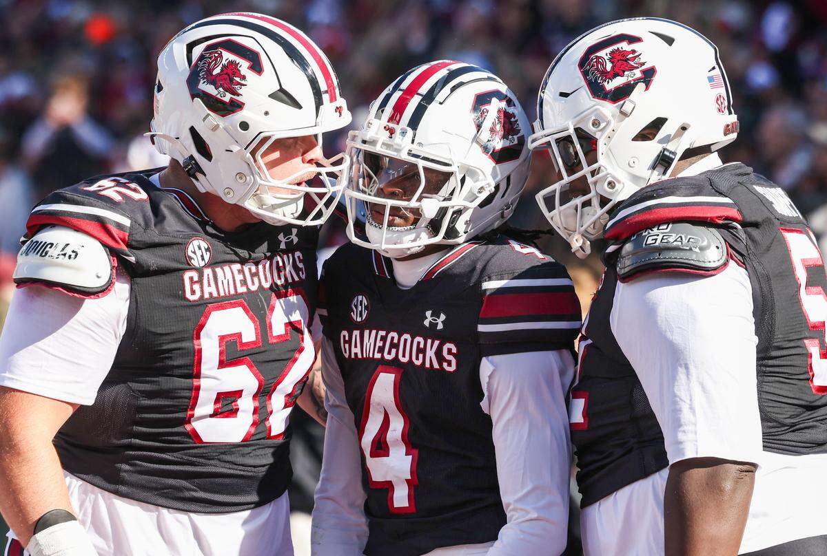 South Carolina wide receiver Vandrevius Jacobs (4) celebrates with offensive lineman Nolan Hay (62) after scoring a touchdown during first half of South Carolina’s game against Clemson at Williams-Brice Stadium in Columbia on Saturday, November 29, 2025.