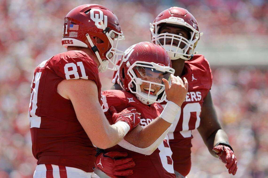 Oklahoma’s Dillon Gabriel (8) celebrates beside Austin Stogner (81) and Cayden Green (70) after running for a touchdown during the team’s game against Arkasnas State at Gaylord Family-Oklahoma Memorial Stadium in Norman, Okla., Saturday, Sept. 2, 2023.