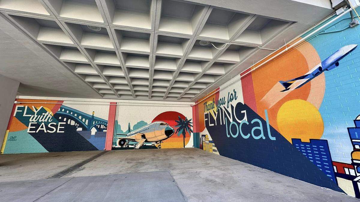 A mural by Girls Who Paint Murals spanning 100+ feet outside of baggage claim was recently completed at the Columbia Metropolitan Airport.