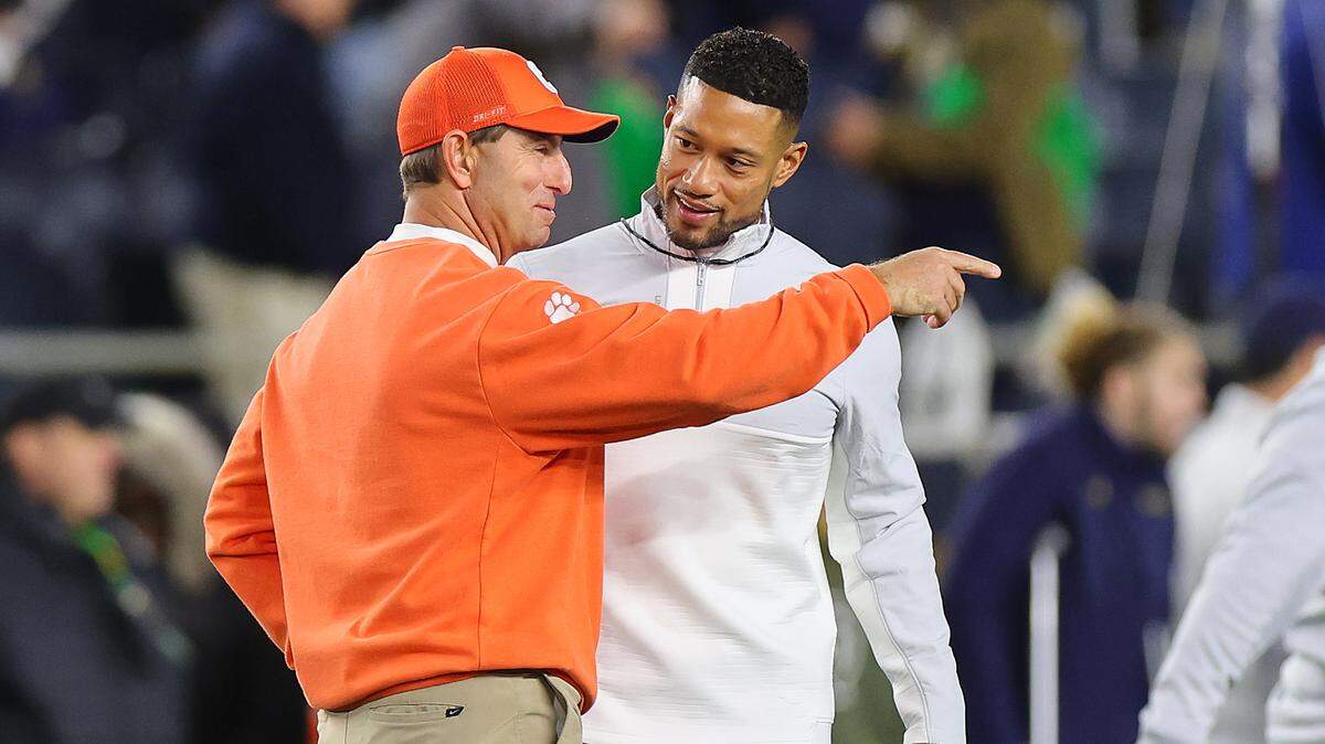 Clemson football coach Dabo Swinney (left) and Notre Dame football coach Marcus Freeman (right) before a 2022 game