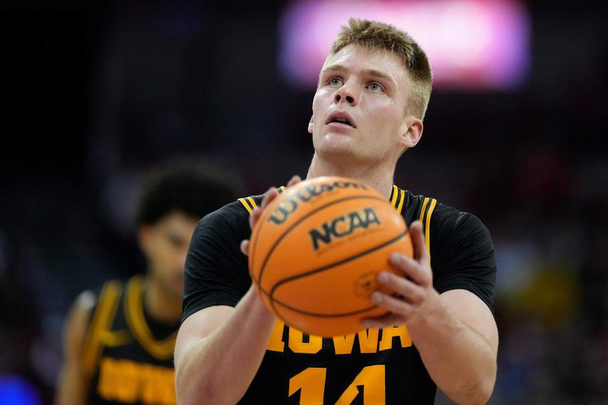 MADISON, WISCONSIN - FEBRUARY 22: Bennett Stirtz #14 of the Iowa Hawkeyes shoots a free throw during the first half against the Wisconsin Badgers at Kohl Center on February 22, 2026 in Madison, Wisconsin.