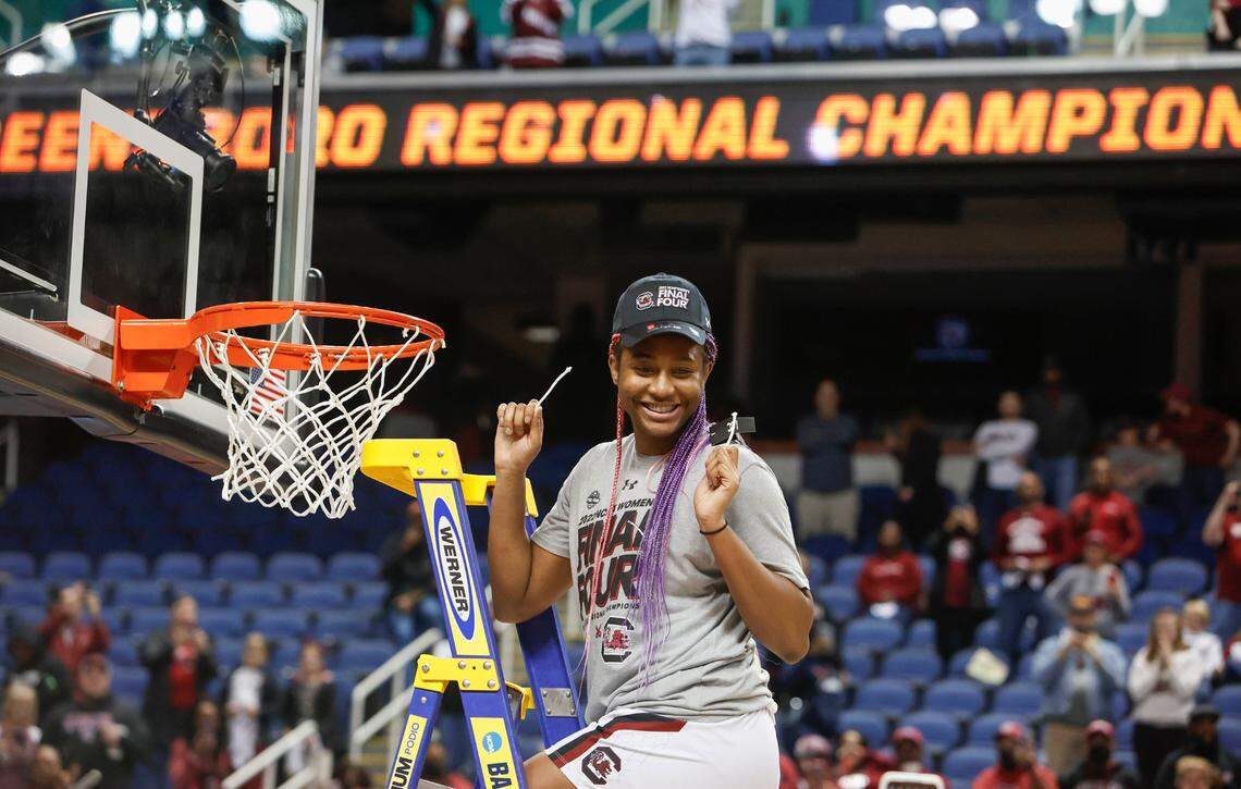 South Carolina’s Aliyah Boston (4) holds a piece of the net after the Gamecocks won the Greensboro Regional. USC beat Creighton University at the Greensboro Coliseum on Sunday March 27, 2022 to advance to the Final Four.