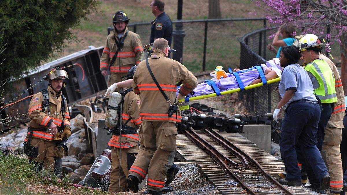 Emergency personnel tend to victims after a children’s train wrecked at Cleveland Park in Spartanburg on March 19. TIM KIMZEY/TIM KIMZEY/tim.kimzey@shj.com