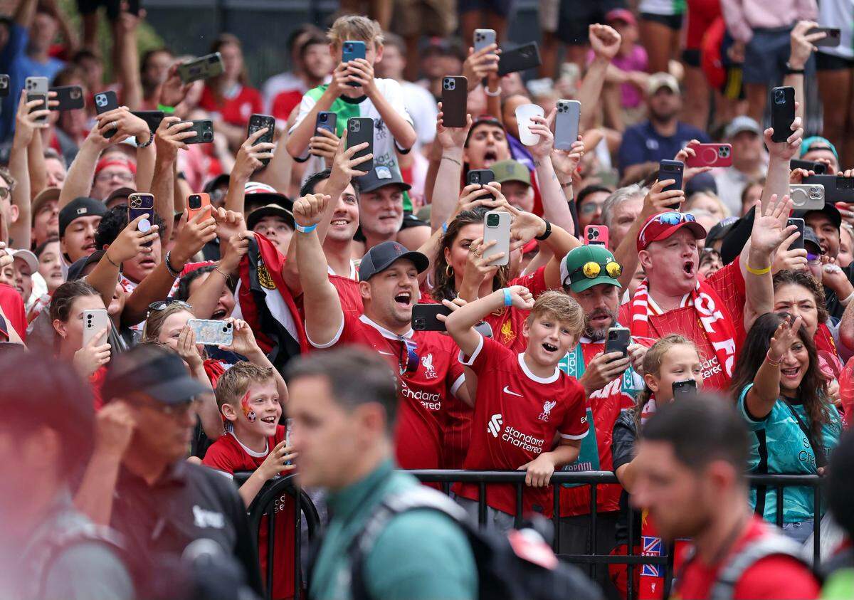 Fans cheer Saturday as the Manchester United and Liverpool soccer teams arrive for their friendly at Williams-Brice Stadium.