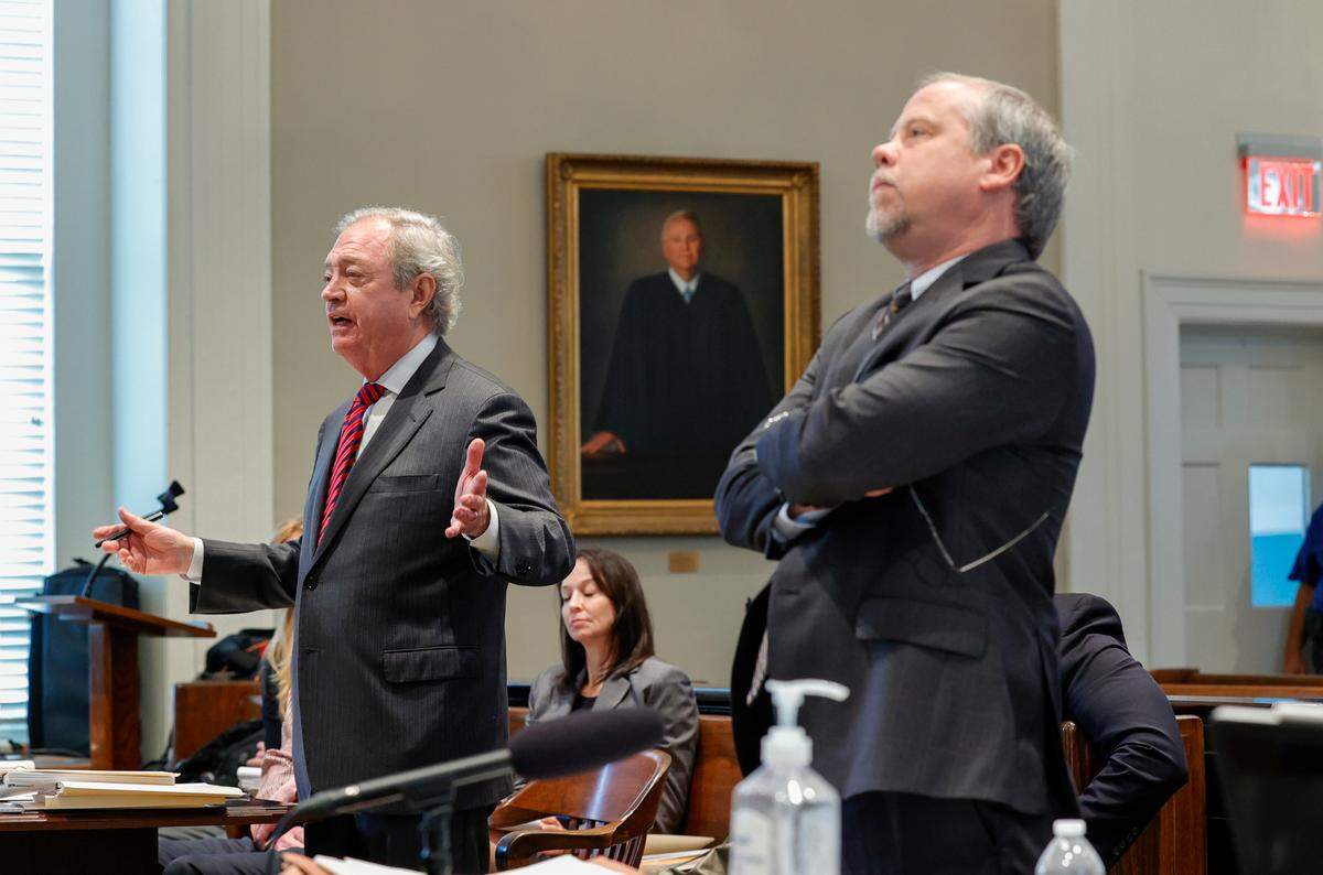 Defense attorney Dick Harpootlian and prosecuting attorney Creighton Waters discuss the release of evidence before Circuit Judge Clifton Newman during a judicial hearing in the Colleton County Courthouse on Monday, Aug. 29, 2022.