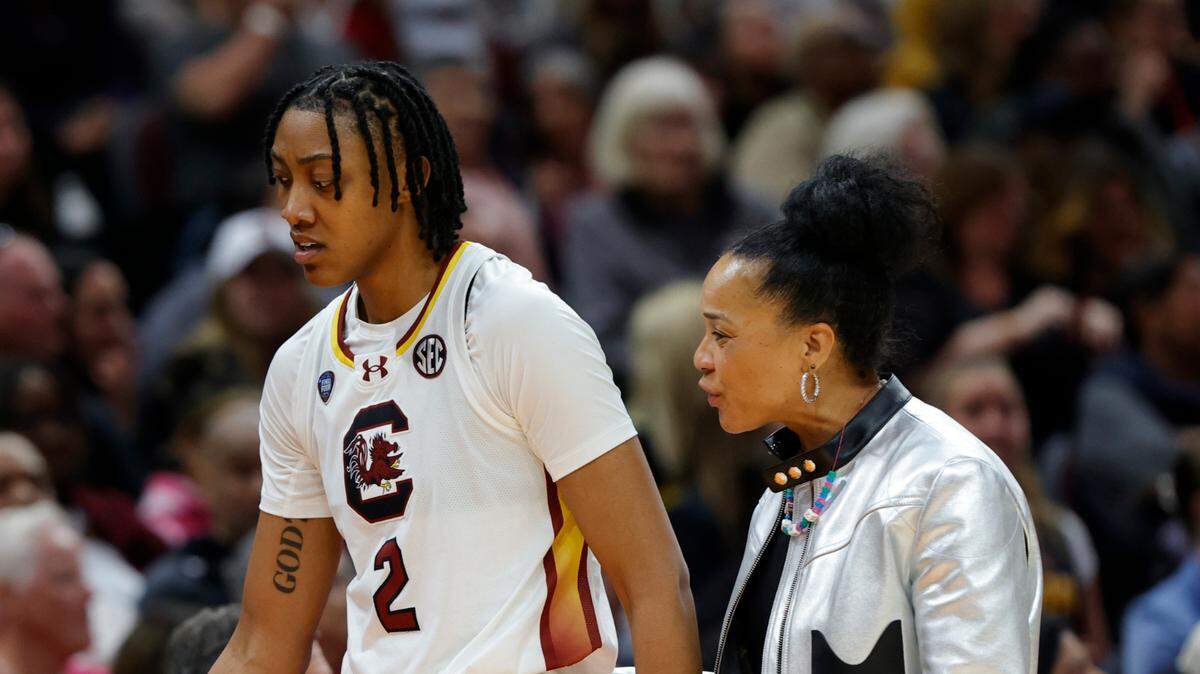 University of South Carolina Head Coach Dawn Staley talks with South Carolina’s Ashlyn Watkins (2) as Watkins came out of the game with foul trouble during the National Championship game at the Rocket Mortgage FieldHouse in Cleveland, Ohio on Sunday April 7, 2024.