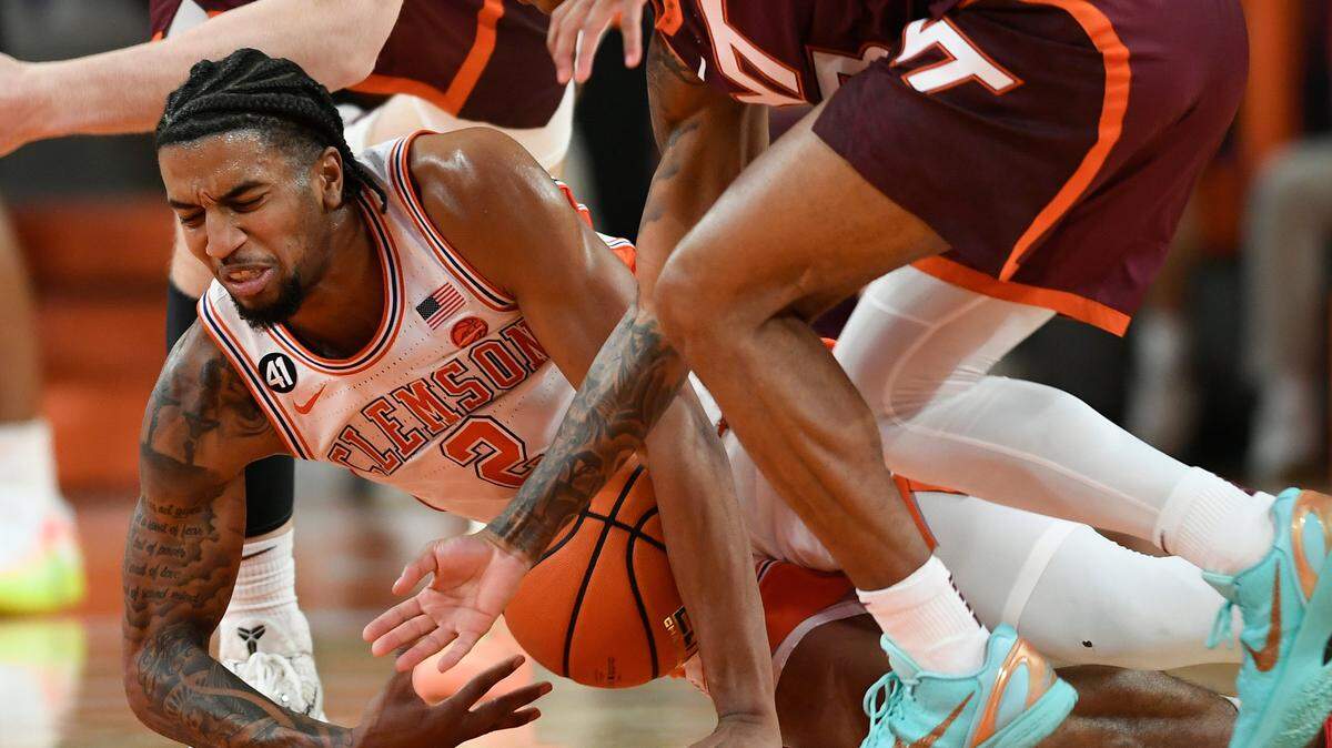 Clemson guard Dillon Hunter (2) fights for a loose ball with Virginia Tech guard Ben Hammond (3) in Clemson, S.C., on Wednesday, February 11, 2026.