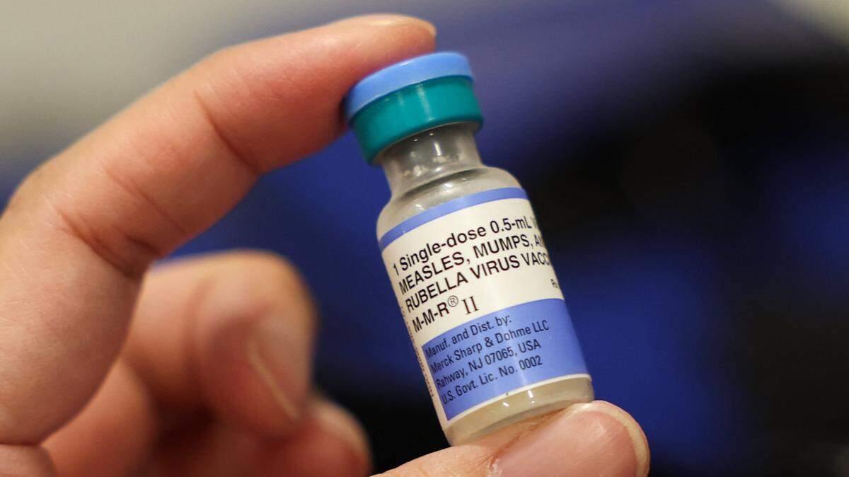 A vial of the Measles, Mumps, and Rubella (MMR) vaccination for children is displayed during an immunization event at the L.A. Care and Blue Shield of California Promise Health Plan Community Resource Center in the Panorama City neighborhood of Los Angeles, California, on October 24, 2025. (Photo by Patrick T. Fallon / AFP) (Photo by PATRICK T. FALLON/AFP via Getty Images)