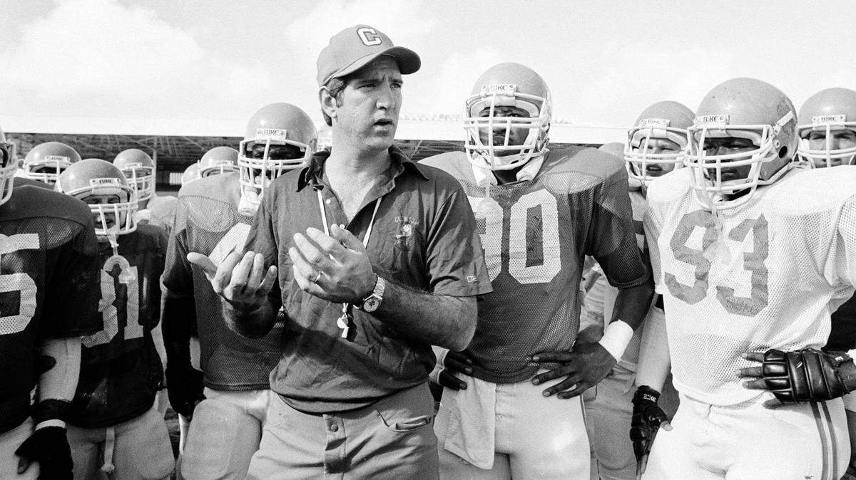 Clemson football coach Danny Ford gives some pointers to his team at Tropical Stadium in Miami where they warmed up for the Orange Bowl on the way to winning the national championship in the game played Jan 1, 1982.