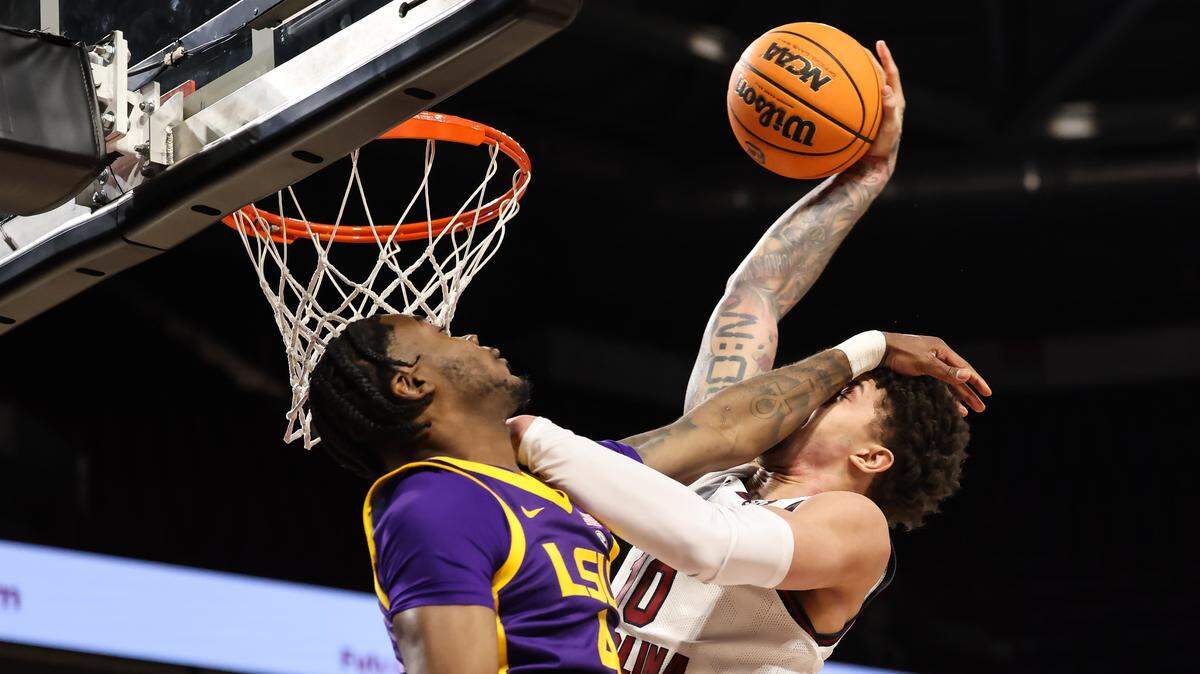 South Carolina forward Myles Stute (10) is fouled as he dunks over Louisiana State guard Rashad King (4) during the Gamecocks’ game against LSU on Saturday, January 31, 2026.

