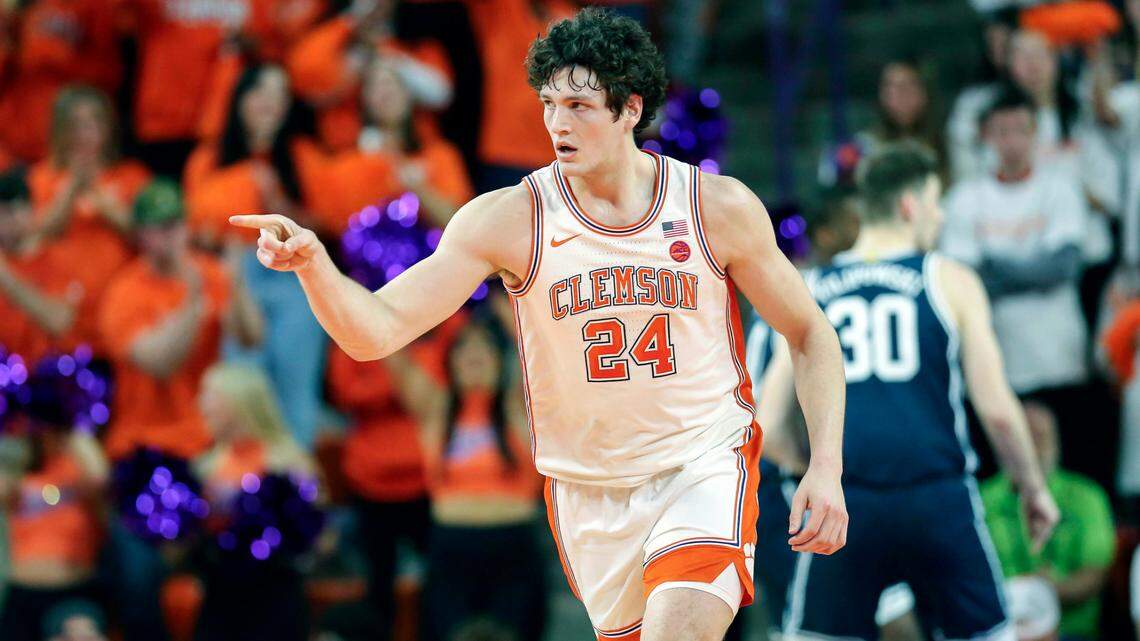 Clemson center PJ Hall (24) points to a teammate after receiving an assist during the first half of an NCAA college basketball game against Duke in Clemson, S.C., Saturday, Jan. 14, 2023. (AP Photo/Artie Walker Jr.)