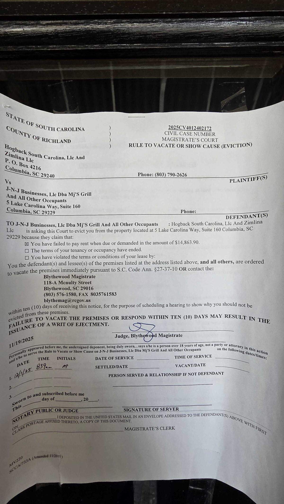 An eviction notice posted to the door of MJ’s Grill show the restaurant was behind in rent by over $14K on Jan. 8, 2026.