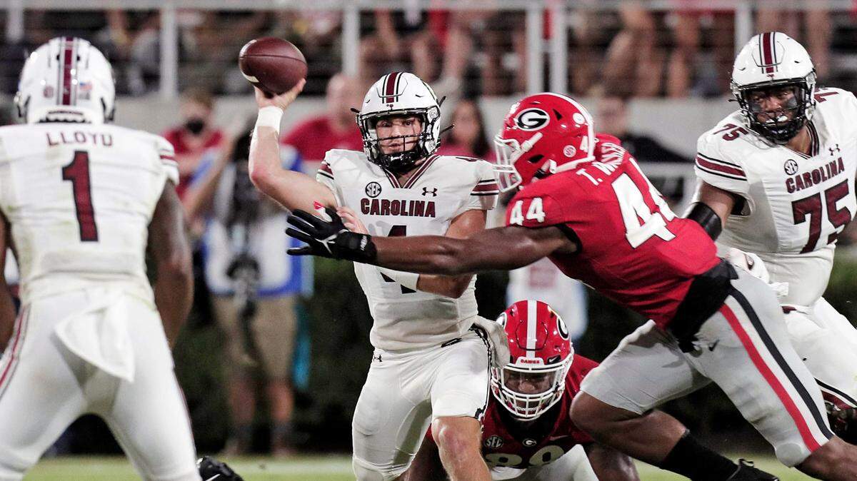 South Carolina quarterback Luke Doty (4) is taken down by Georgia Bulldogs defensive lineman Travon Walker (44) at Sanford Stadium on Sept. 18, 2021. Walker is gathering interest from NFL scouts of teams like the Panthers that pick in the draft’s top 10.