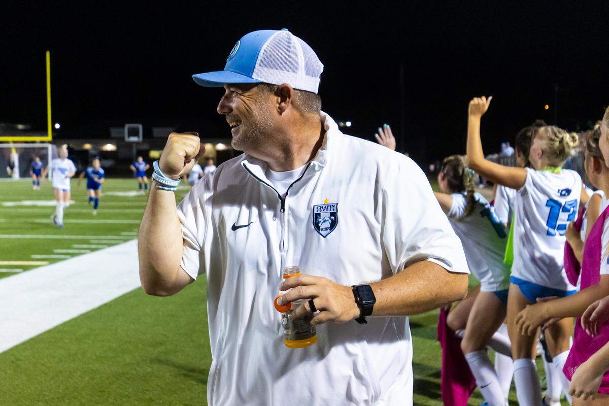 Chapin High Eagles head coach Chad Bridges celebrates during Chapin’s 4-0 win in the Class 5A-Division II state championship game at Memorial Stadium in Columbia, South Carolina, on Saturday. 