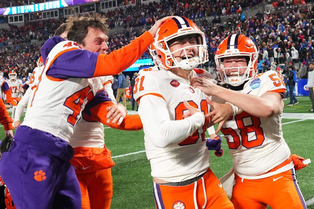 Nolan Hauser (81) of the Clemson Tigers celebrates with teammates after kicking a game-winning 56-yard field goal in the 2024 ACC Football Championship in Charlotte on Dec. 7, 2024.