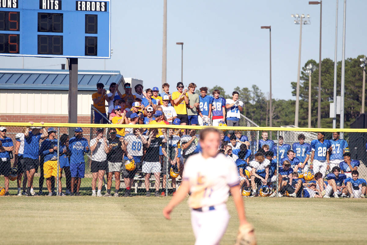 The Lexington football team looked on from right field during the softball team’s win Tuesday over Summerville.