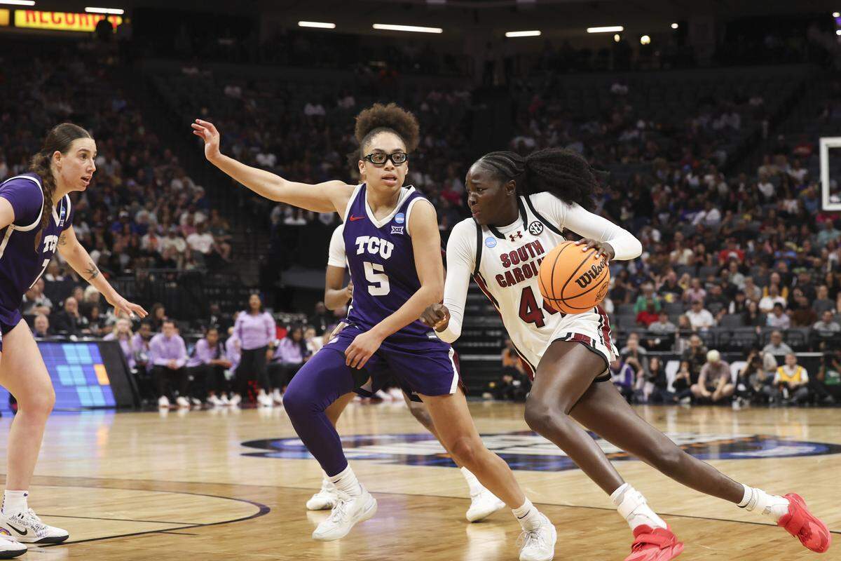 South Carolina's Agot Makeer (44) drives to the basket as TCU’s Olivia Miles (5) pressures during the second half of action of their Elite Eight women's basketball game against TCU at Golden 1 Arena on Monday, March 30, 2026.