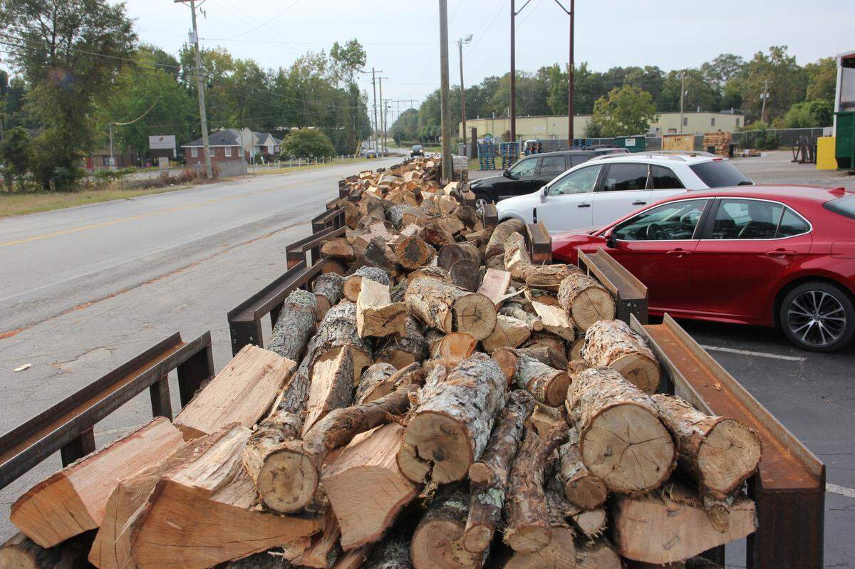A long row of wood sits ready to be consumed at Maurice’s Piggie Park BBQ. Oct. 11, 2023