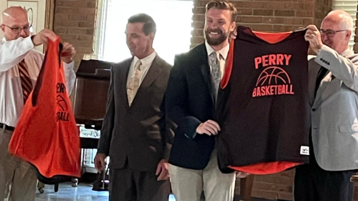 Simpsonville United Methodist Church presents new jerseys to Perry Correctional Institution on Sunday. From left, Simpsonville United Methodist Church Pastor Mike Smith, Perry Chaplain Larry Epps, Perry Athletic Director Cole Bullock and state Rep. Garry Smith.