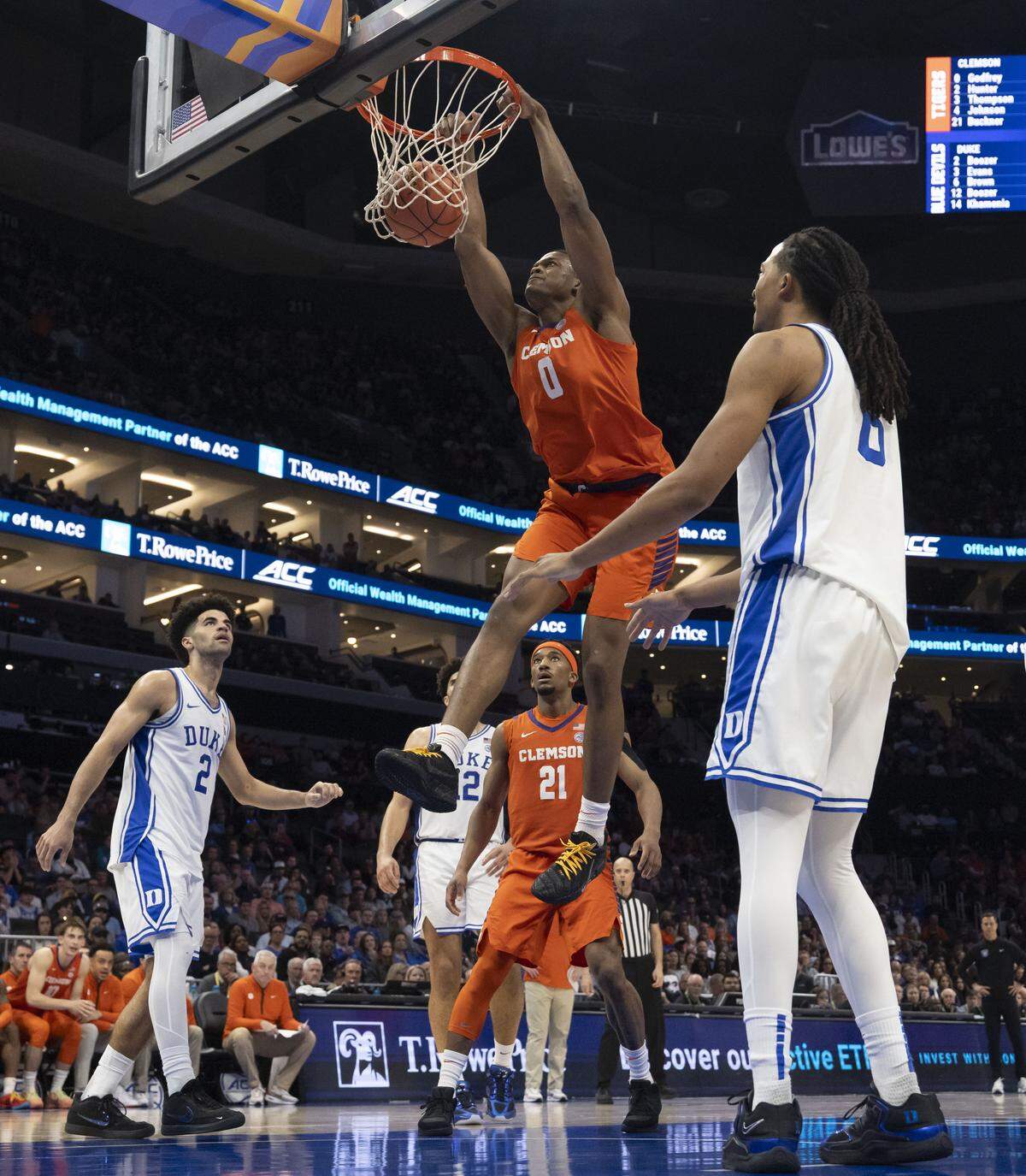 Clemson forward RJ Godfrey (0) gets a second-half dunk for two of his game-high 20 points against Duke on Friday, March 13, 2026, during the semifinals of the ACC Tournament at Spectrum Center in Charlotte, North Carolina.