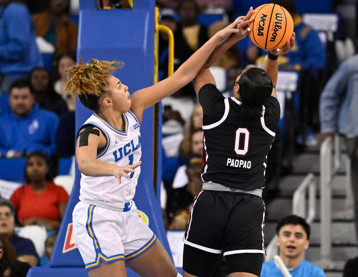 UCLA Bruins guard Kiki Rice (1) blocks a shot by South Carolina Gamecocks guard Te-Hina Paopao (0) during the first quarter at Pauley Pavilion presented by Wescom.