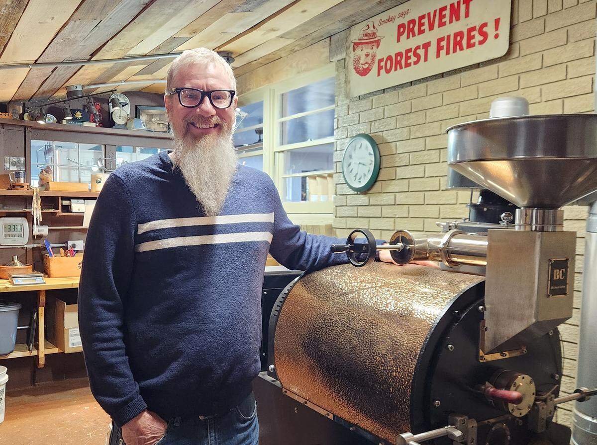 Jim Huthmaker, co-owner of Righteous Grounds Coffee Roasters, stops for a photo in the roasting room at the company’s Barr Road facility in Lexington.