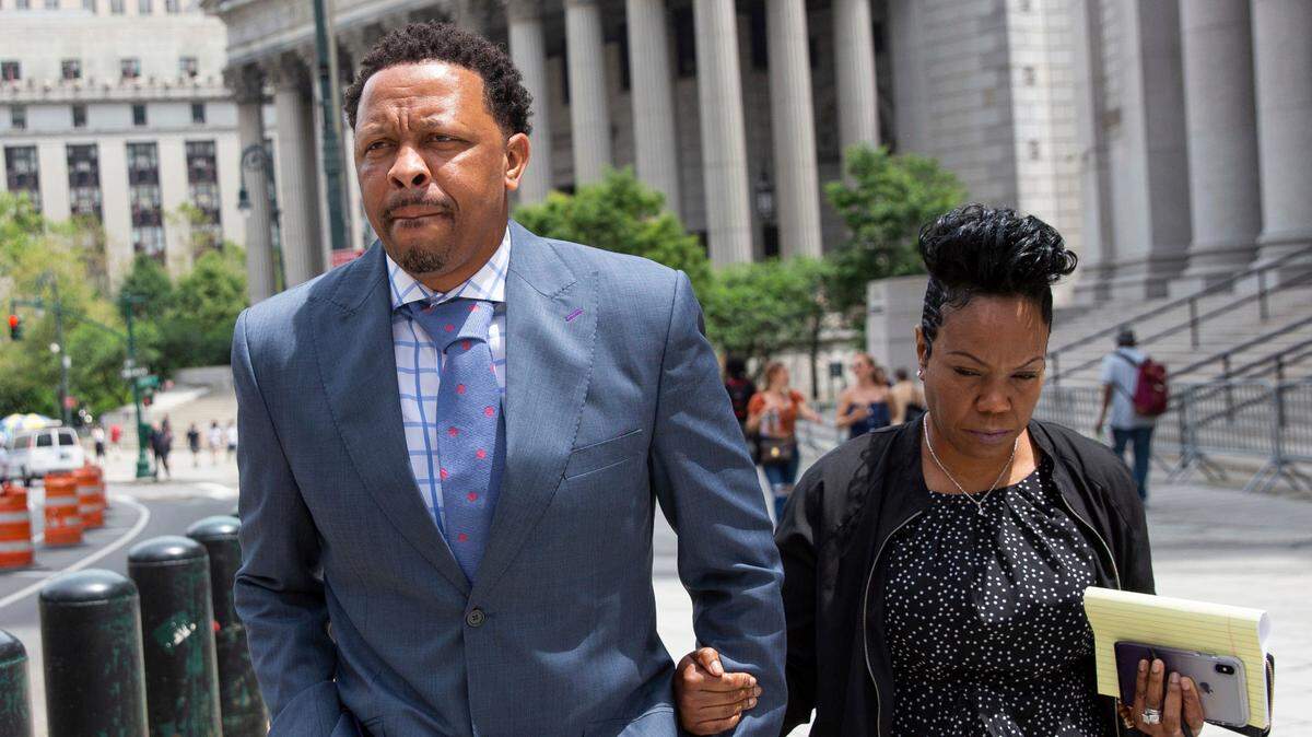 FILE - In this June 7, 2019, file photo, former Oklahoma State assistant basketball coach Lamont Evans leaves Federal Court in New York. An NCAA infractions committee panel announced Friday, June 5 2020, that former Oklahoma State assistant men’s basketball coach Lamont Evans violated ethical-conduct rules by accepting up to $22,000 in bribes from financial advisers. (AP Photo/Kevin Hagen, File)