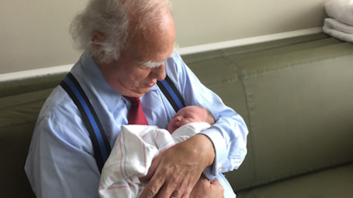 Greenville defense attorney holds his grandson and namesake, James H. “Jay” Price V.