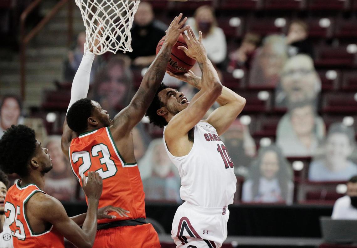 South Carolina Gamecocks forward Justin Minaya (10) is defended by Florida A&M Rattlers forward Bryce Moragne (23) on January 2, 2021.