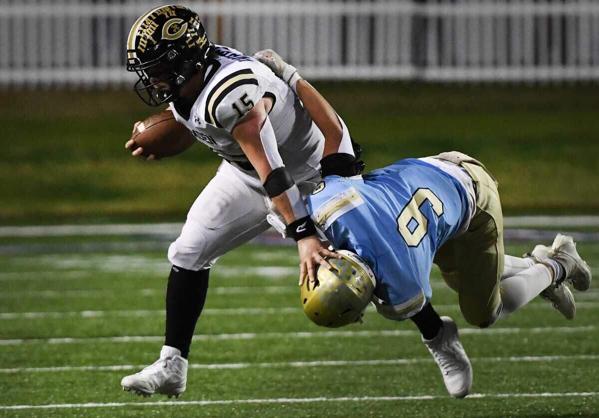 Camden’s Grayson White (15) with the ball as Daniel’s Ben Joplin (9) tries to make the stop during the Class 3A championship game on Dec. 2, 2023 at South Carolina State University in Orangeburg.