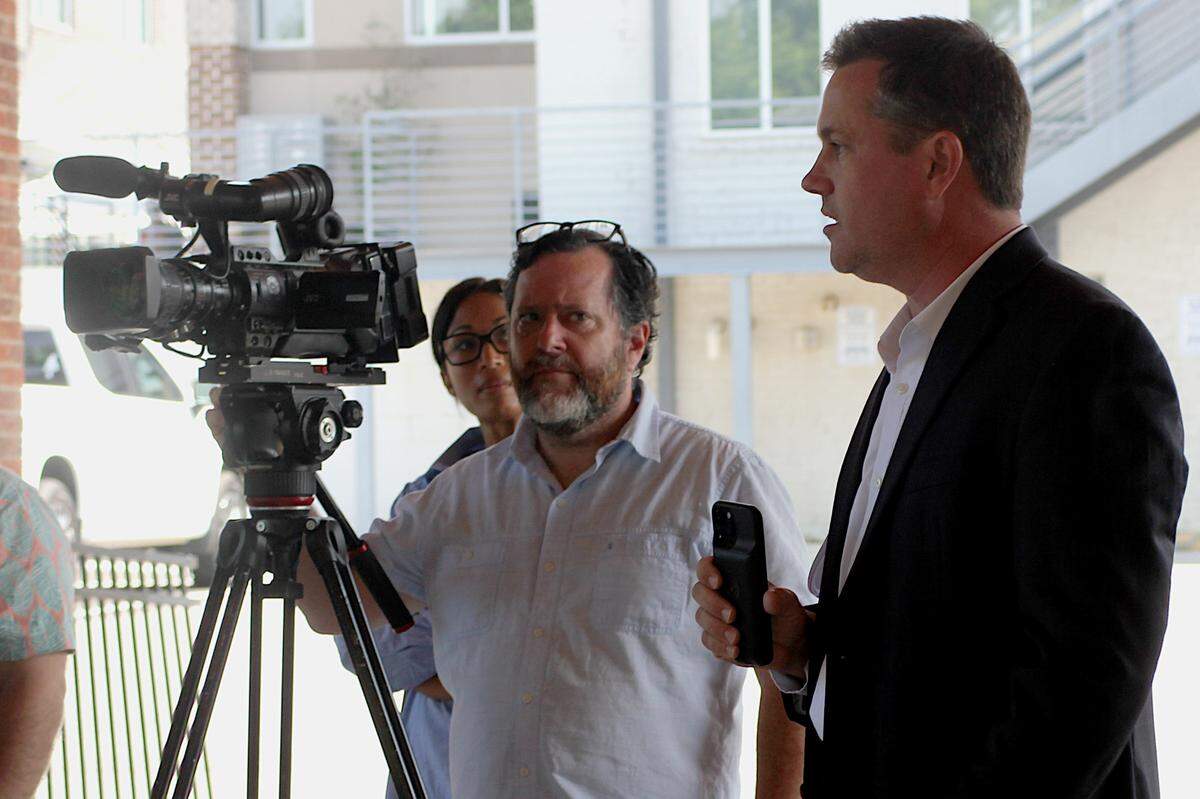 Lexington County Council Candidate Brent Munnerlyn (right) interjects during a May 24, 2024 press conference.