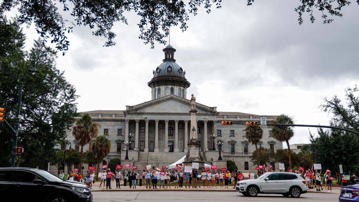 People rally outside the South Carolina Statehouse as members of the South Carolina House of Representatives prepare to vote on legislation related to an abortion ban in the state on Tuesday, Aug. 30, 2022.