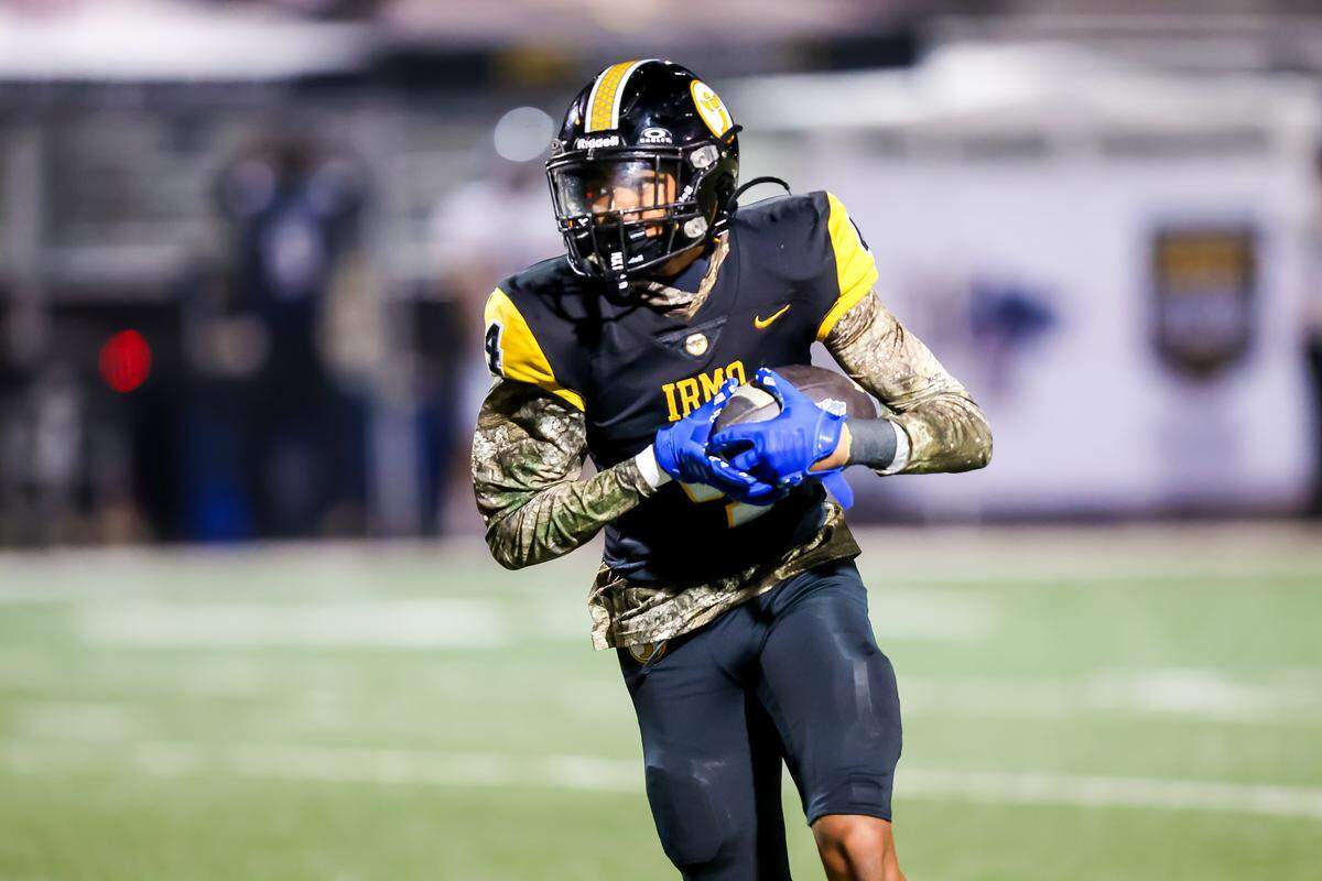 Irmo Yellowjackets defensive back Jamar Grissett (4) returns an interception against the White Knoll Timberwolves during their game at Irmo High School Friday evening, 11/21/25.