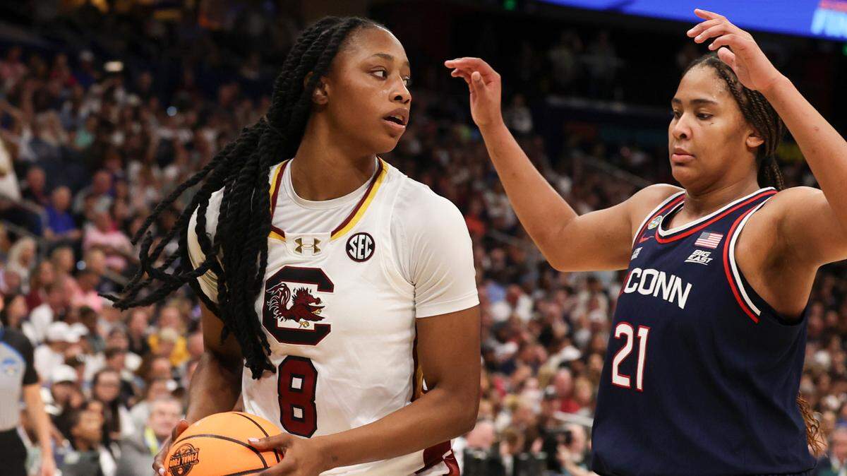 University of South Carolina’s Joyce Edwards (8) is pressured by University of Connecticut’s Sarah Strong (21) during the second half of action against the University of Connecticut for the NCAA National Championship at Amalie Arena in Tampa, Fla. on Sunday, April 6, 2025.