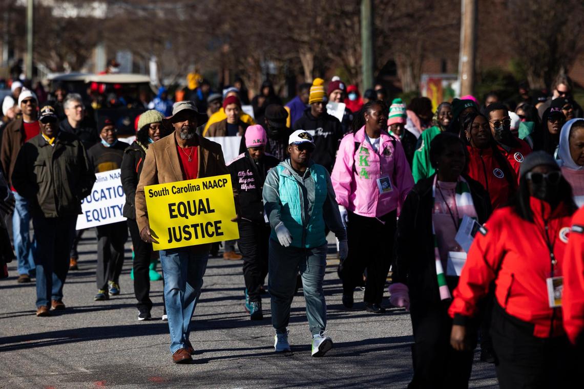People march to the South Carolina State House for King Day at the Dome, a Martin Luther King Day celebration hosted by the South Carolina NAACP, on Monday, January 16, 2023. Members of local and statewide civil rights organizations, religious and labor unions marched from Zion Baptist Church to the state capitol for the celebration.
