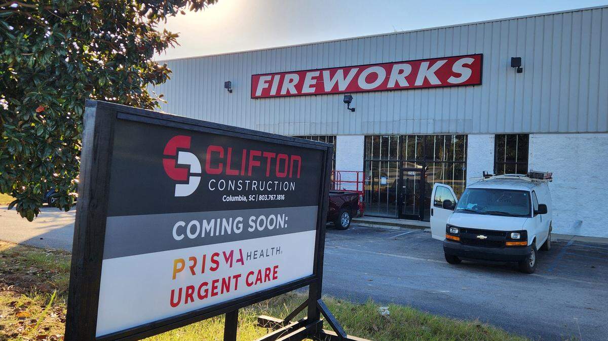 A sign touts the coming of a Prisma Urgent Care facility at an Augusta Road building that has long been a fireworks store and site of a seasonal Halloween business.