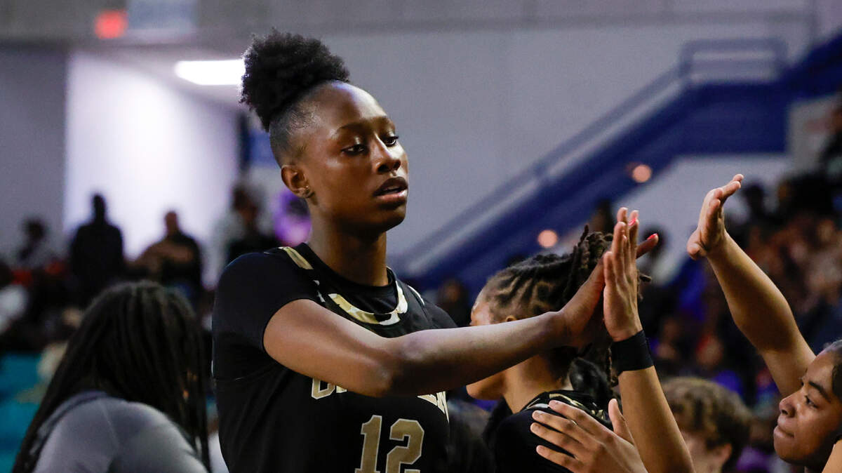 Camden’s Joyce Edwards greets teammates after coming off the court for the last time during Class 3A girls basketball championship game on Saturday, March. 2, 2024. Camden won their second straight state championship, 44-22 over Wren.