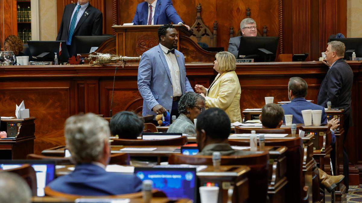 S.C. Rep. Jermaine Johnson, D-Richland And S.C. Rep. Shannon Erickson, R-Beaufort speak together during discussion of an education voucher bill on Wednesday April 26, 2023 in the South Carolina State House.
