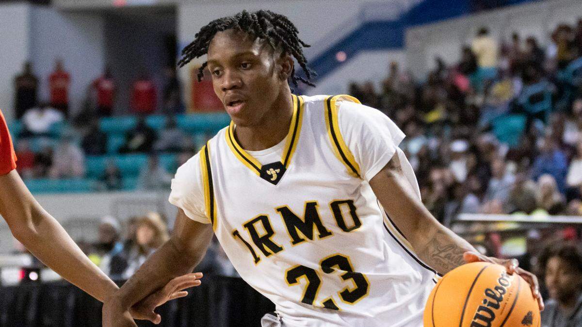 Te’Andre Summons (23) of Irmo drives past Sahquan Pendergrass (1) of Hartsville during Irmo’s game against Hartsville at the Florence Center in Florence on Friday, February 24, 2023.