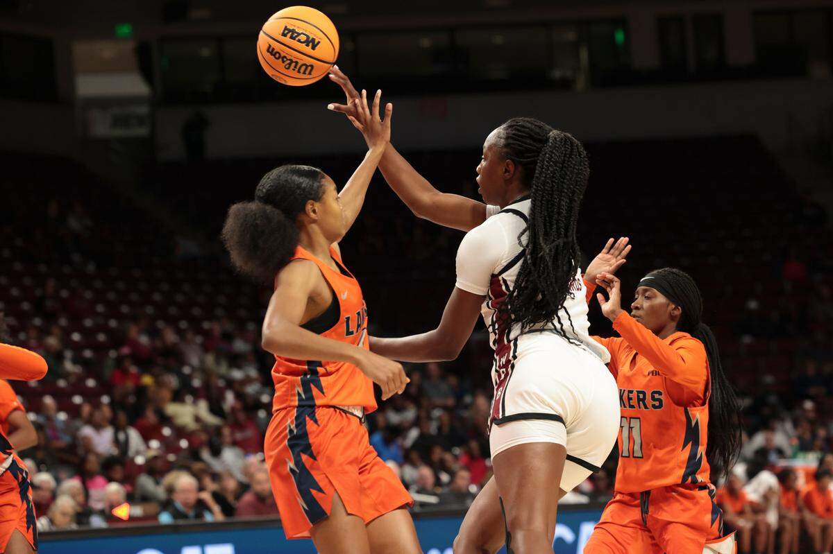 University of South Carolina forward Joyce Edwards (8) passes as Clayton State’s Sariya Henry (1) and Jadah Waite (11) pressure during the second half of action in the Colonial Life Arena on Monday, Oct. 28, 2024.