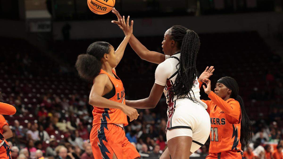 University of South Carolina forward Joyce Edwards (8) passes as Clayton State’s Sariya Henry (1) and Jadah Waite (11) pressure during the second half of action in the Colonial Life Arena on Monday, Oct. 28, 2024.