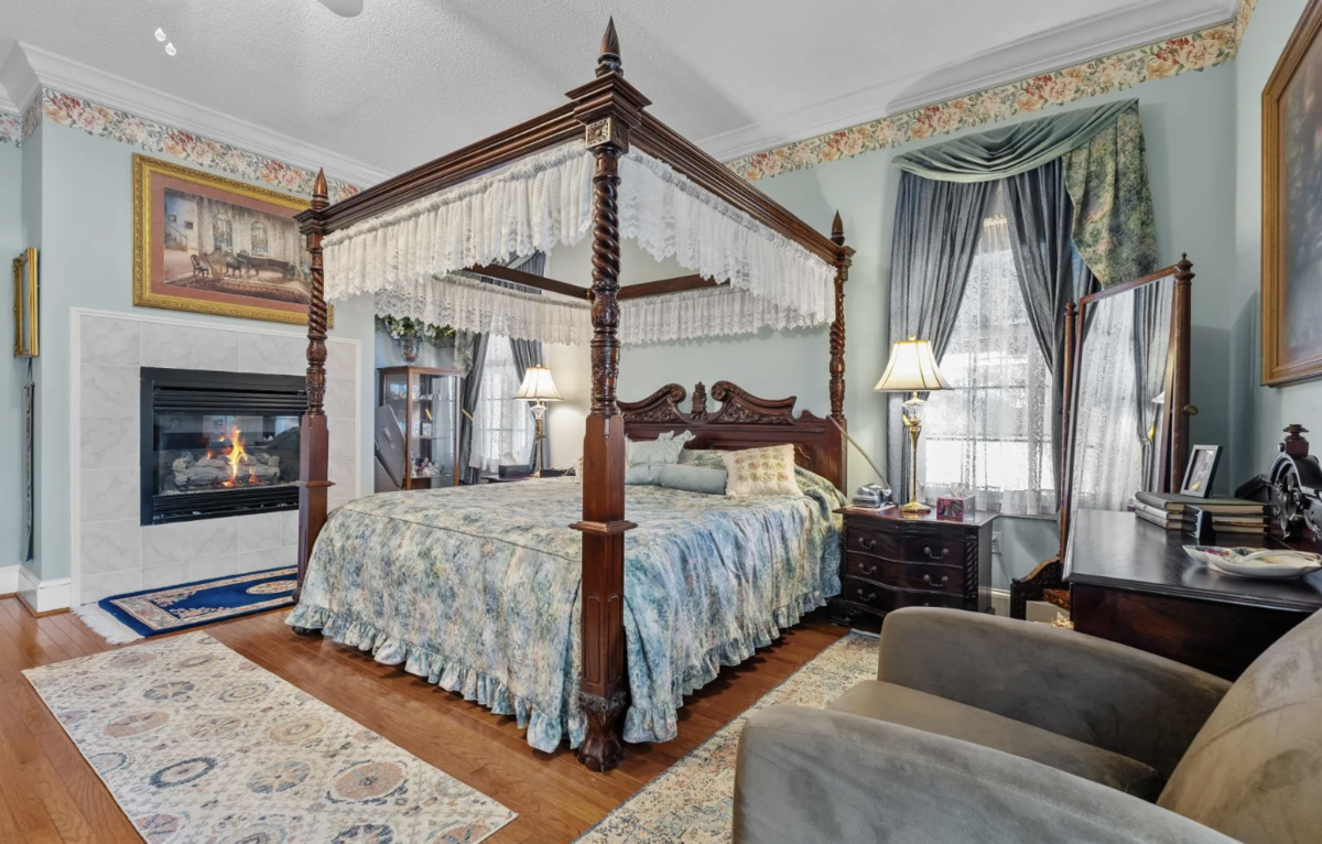 The primary suite includes a fireplace, walk-in closet and jet tub.