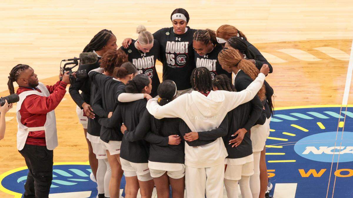 The Gamecocks huddle at center court before playing Texas in the Final Four semifinal game at Amalie Arena in Tampa, Fla. on Friday, April 4, 2025.