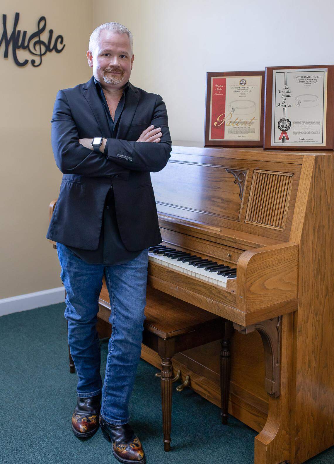 The Director of the Columbia Arts Academy, Marty Fort, patented a system to motivate music students.