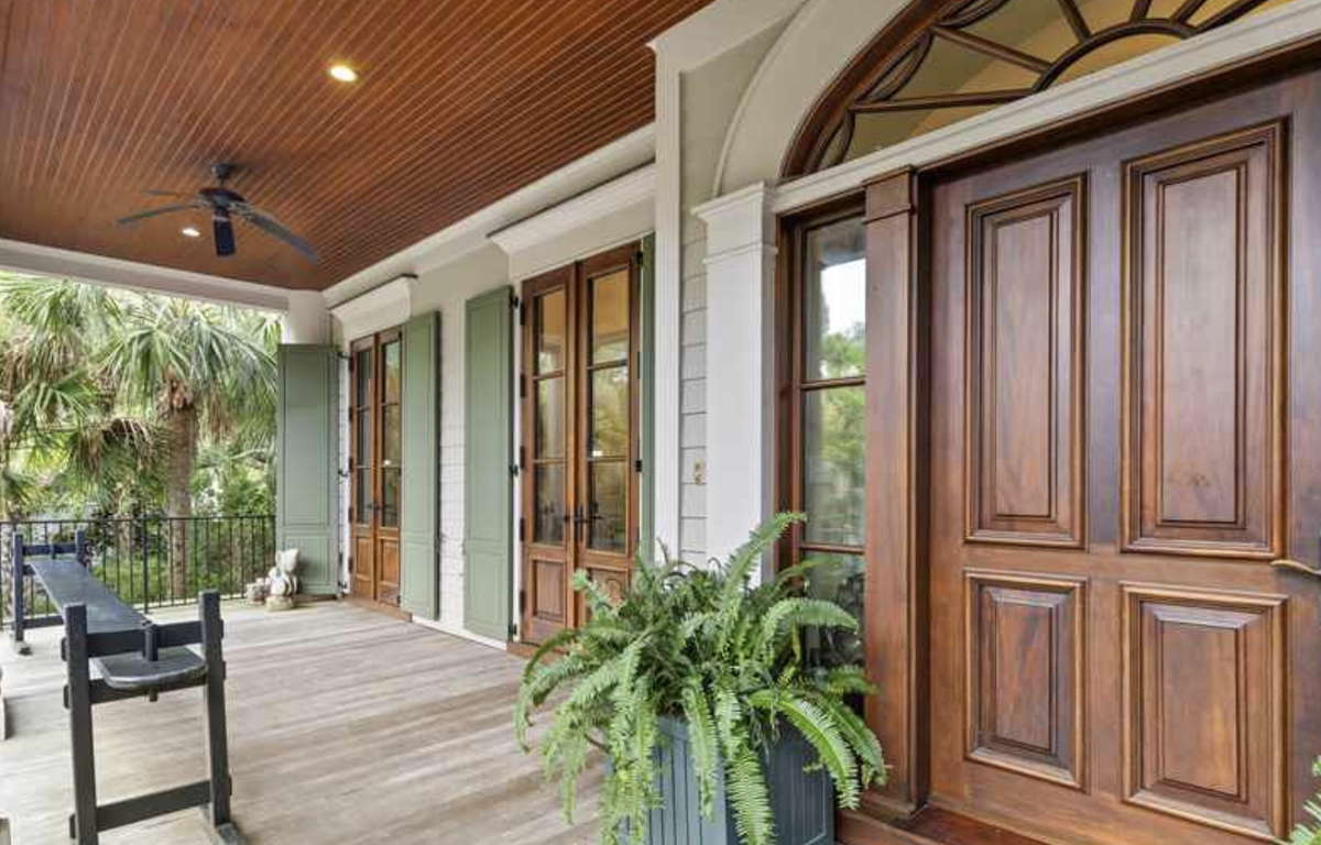 The house has several porches. A joggling board is on the front porch.
