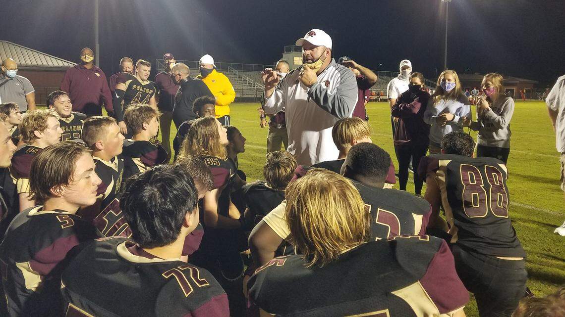 Pelion football coach Dann Holland talks to his team following the 12-6 win over Wade Hampton on Nov. 5, 2020.