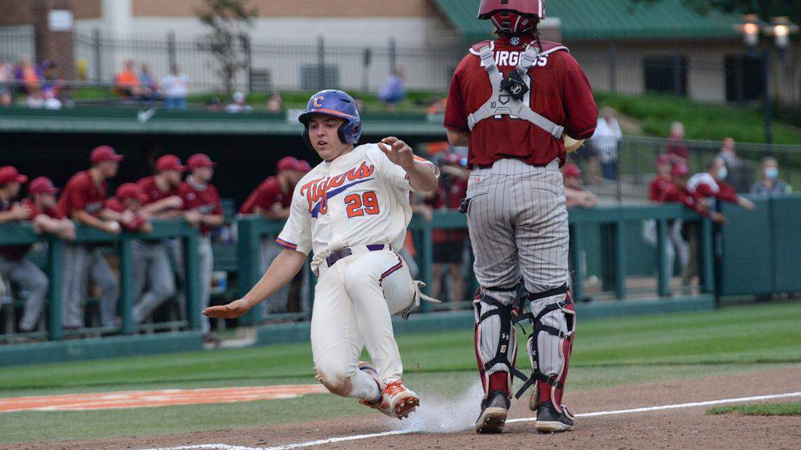 Clemson freshman Max Wagner(29) scores by South Carolina sophomore Colin Burgess(10) during the bottom of the fifth inning at Doug Kingsmore Stadium in Clemson Tuesday, May 11,2021.