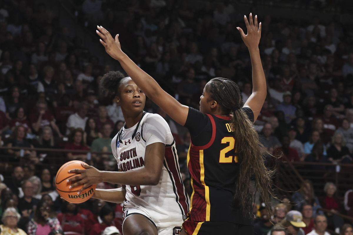 South Carolina's Joyce Edwards (8) looks to pass around University of Southern California's Kara Dunn (25) during the first half of action of their women's basketball game against University of Southern California in the first round game of the NCAA Tournament at Colonial Life Arena on Monday, March 23, 2026.